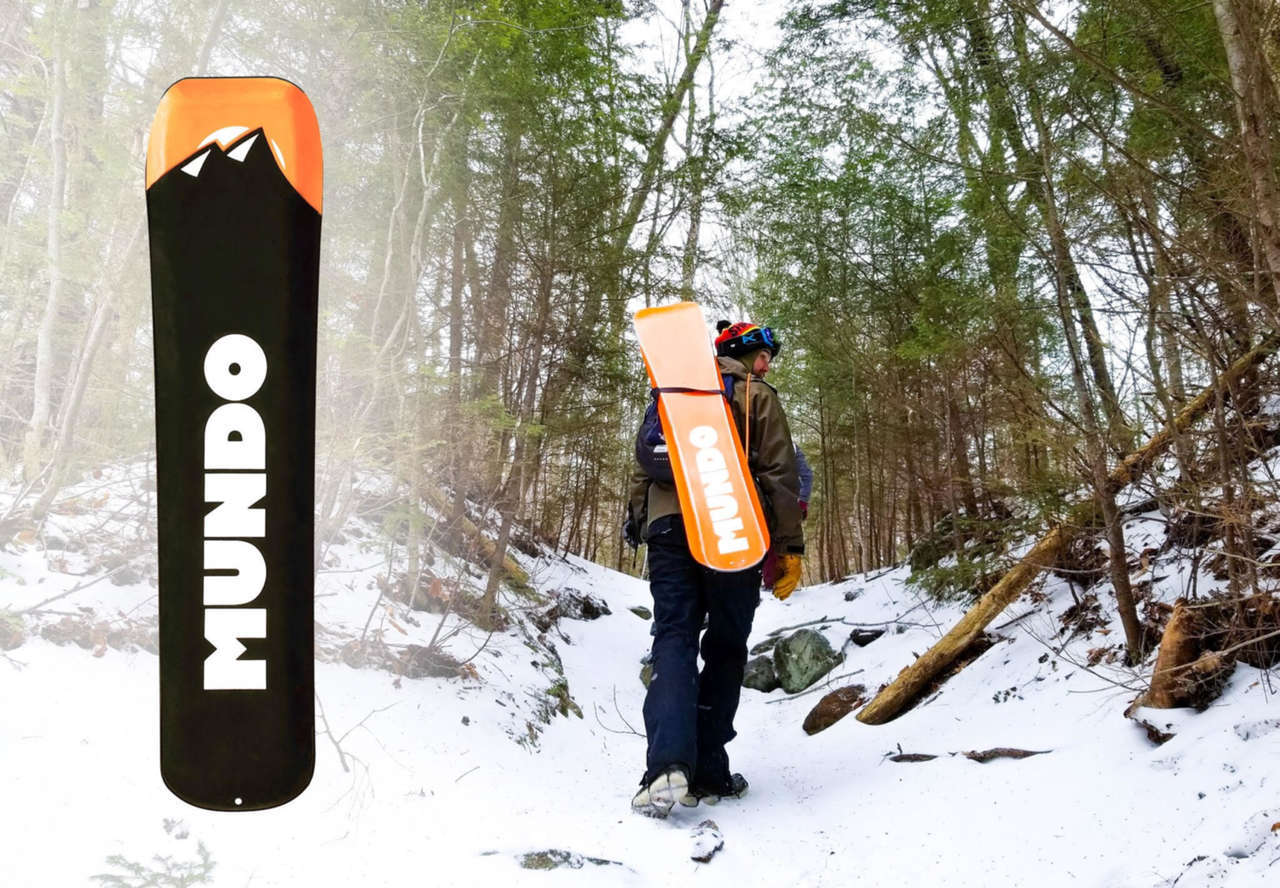 Mundo Trailboard being walked up trail