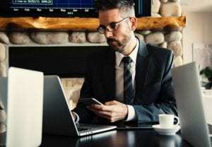 Man holding smartphone to use AI Chatbot