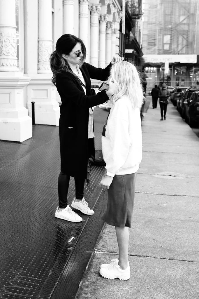 Shani Lechan fixing wig worn by model