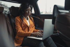 CEO on laptop in car self-compassion