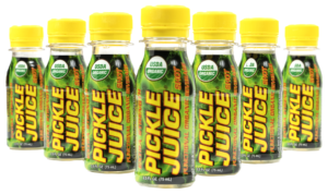 Image of Pickle Juice® Extra Strength shots, showcasing the compact 2.5-ounce bottles with bold green and yellow labels. The shots are designed for athletes and anyone seeking quick relief from muscle cramps and dehydration, with a focus on delivering up to 15 times the electrolytes of traditional sports drinks.