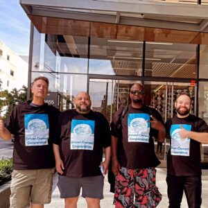 Ivan and other Fare Co-op team members pose in San Francisco wearing matching 