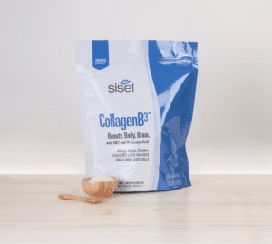 Sisel International's CollagenB3™ collagen supplement with MCT and hyaluronic acid shown on a wooden surface with a scoop of powder in front.