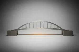 Minimalist metal bridge model linking two stone blocks on a soft gray background, symbolizing connection with external stakeholders.