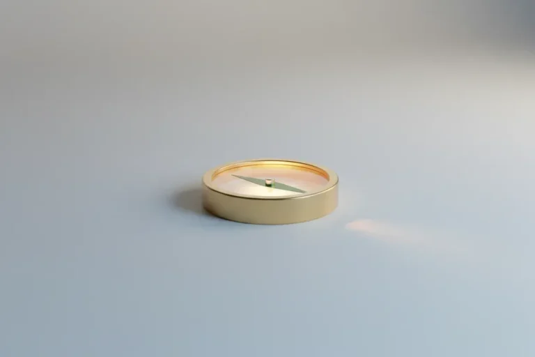 Single brass compass with a green leaf-shaped needle on a soft neutral background, symbolizing purpose-driven leadership.