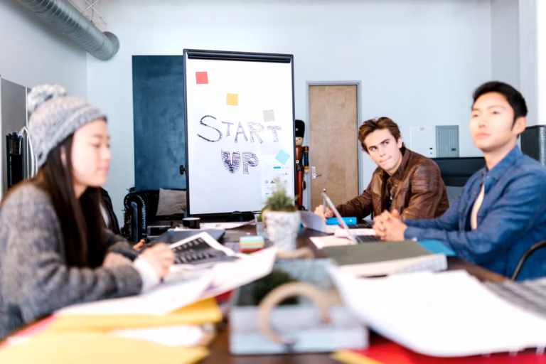 diverse entrepreneurs discussing growth strategy at conference